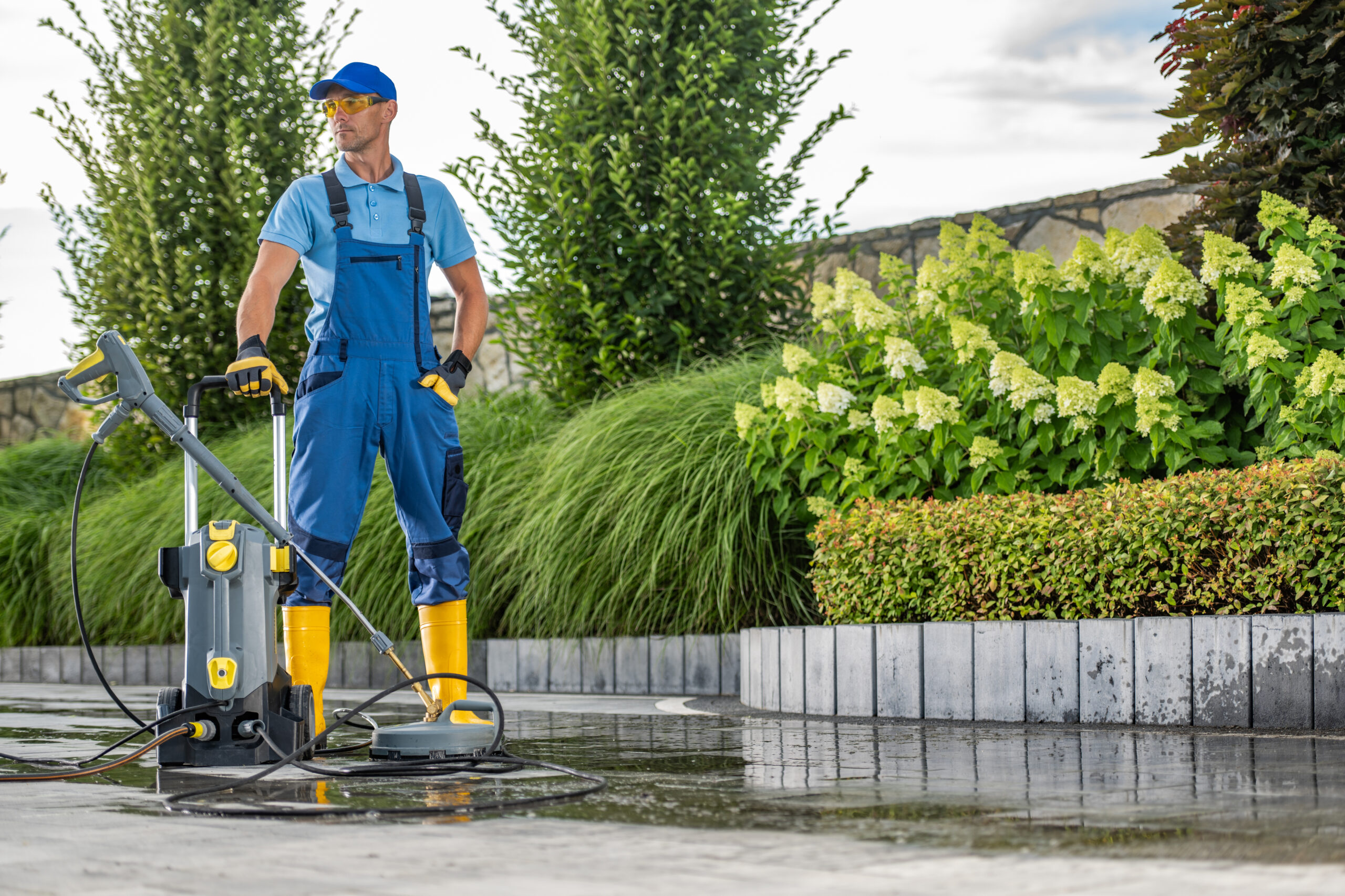 driveway pressure washing performed by worker 2024 02 06 14 31 38 utc scaled