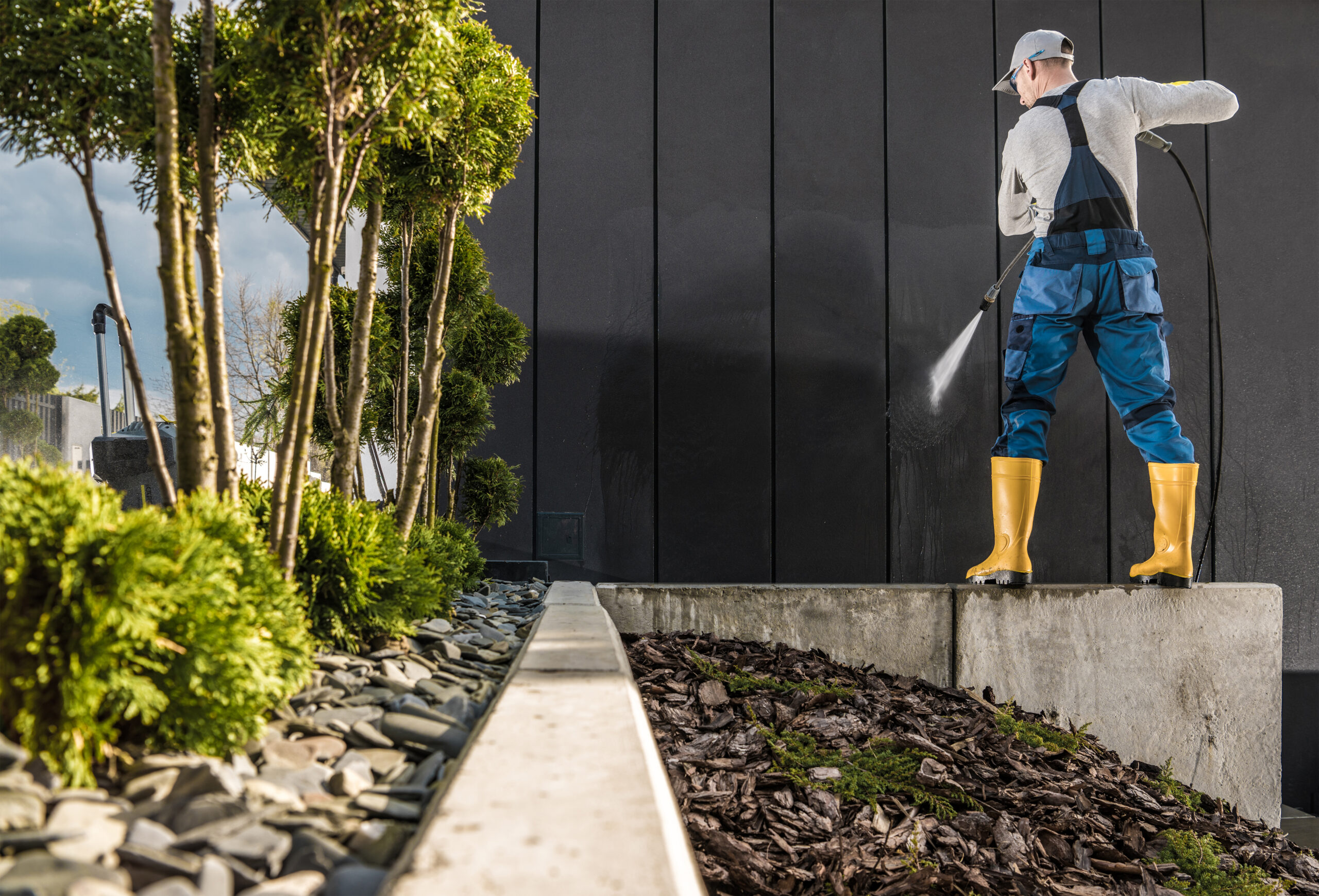 professional worker pressure washing house walls 2025 03 14 13 08 42 utc scaled